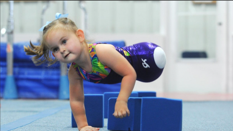 An 8-year-old girl who was born without legs became a professional gymnast