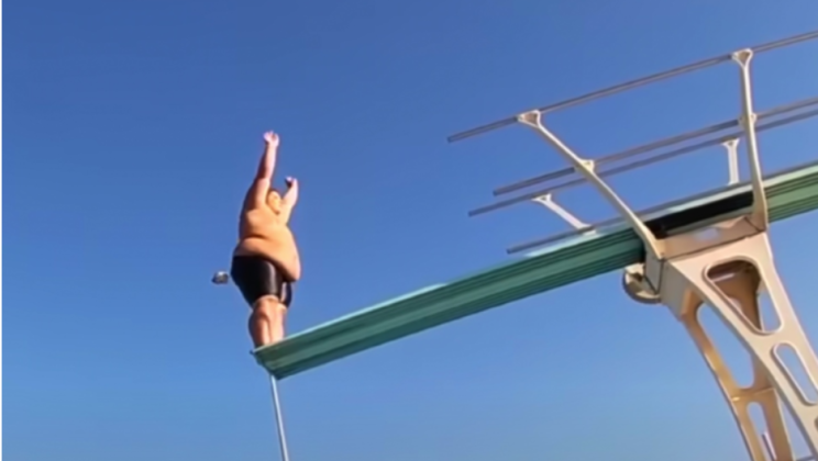 Bigger bodied 14-year-old diver plunges off diving board making headlines when he starts to flip