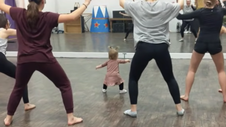 A 2-year-old girl showed adults how to dance.