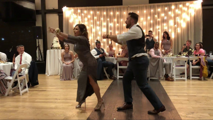 Guests start to holler when attractive mom and son duo put on show-stopping routine at wedding