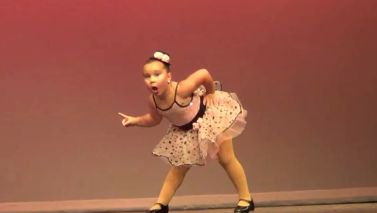3 tiny dancers line up facing the wall, but when they turn around, the audience is lost in laughter
