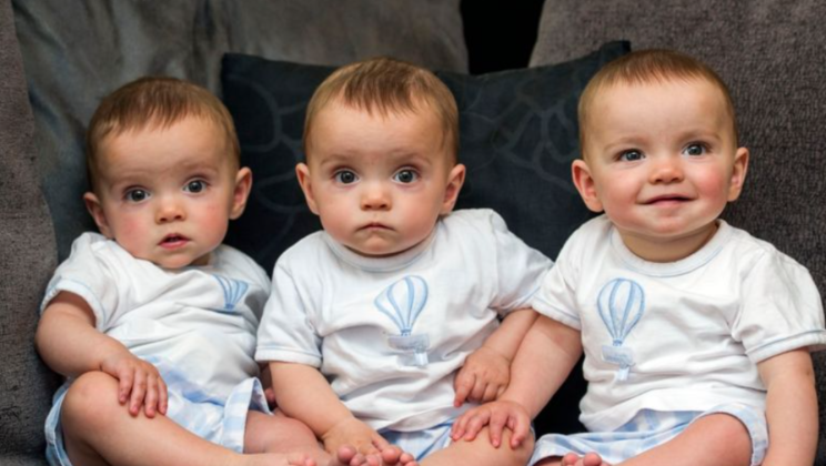 Absolutely identical triplets. They are already 7 years old: how handsome brothers grow and look