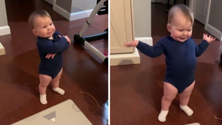 The little boy is telling his father something. He doesn’t seem to like something